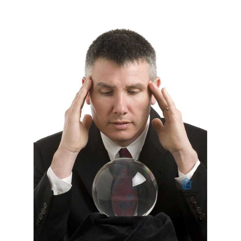 Business man with crystal ball looks for guidance
